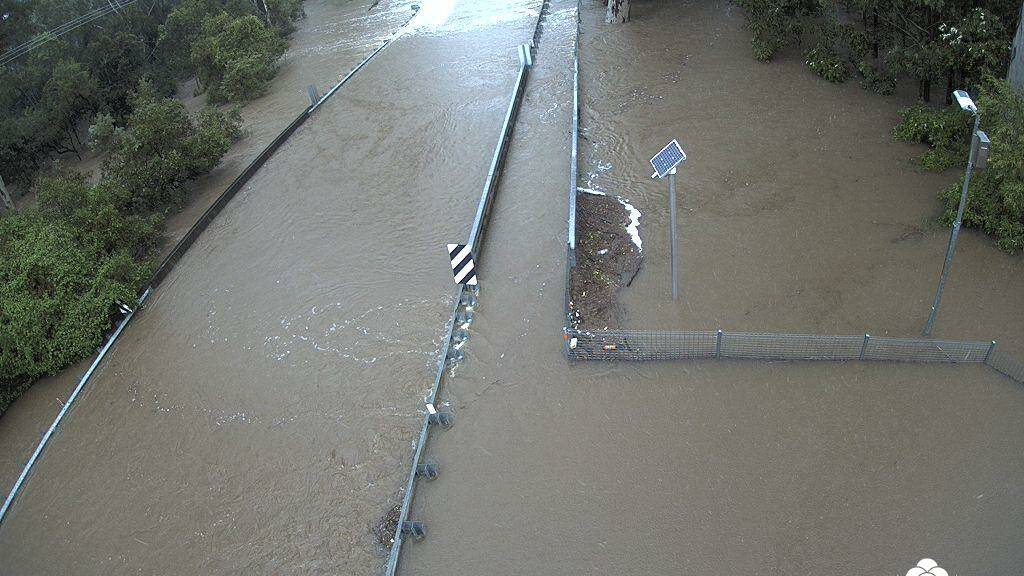 FLOOD: The Henderson Creek bridge at Cusack Lane in Jimboomba under water in 2017. Photo: Logan Disaster Dashboard