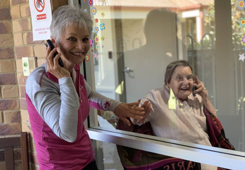 LOCKDOWN: Rhonda Collins visits her 100-year-old mum at Beaudesert. Photo: Larraine Sathicq
