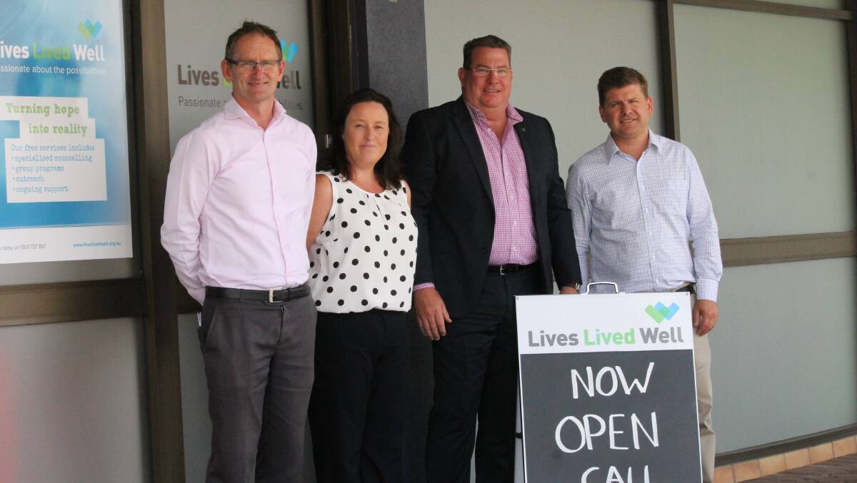 OPEN: Mitchell Giles and Ronelle Waring from Lives Lived Well at the Brisbane Street opening in January with federal MP Scott Buchholz and state MP Jon Krause. Photo: Larraine Sathicq