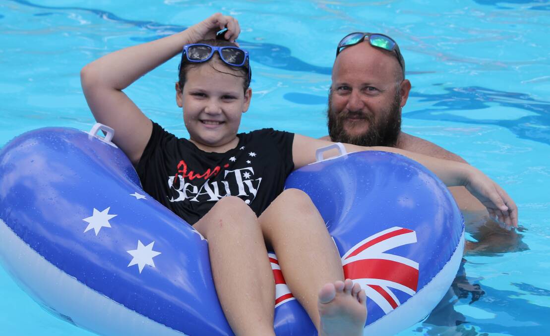 AUSSIE DAY: At last year's council pool party, Kayla Archer, aged 10, with her dad Kaz from Beaudesert. Photo: Larraine Sathicq