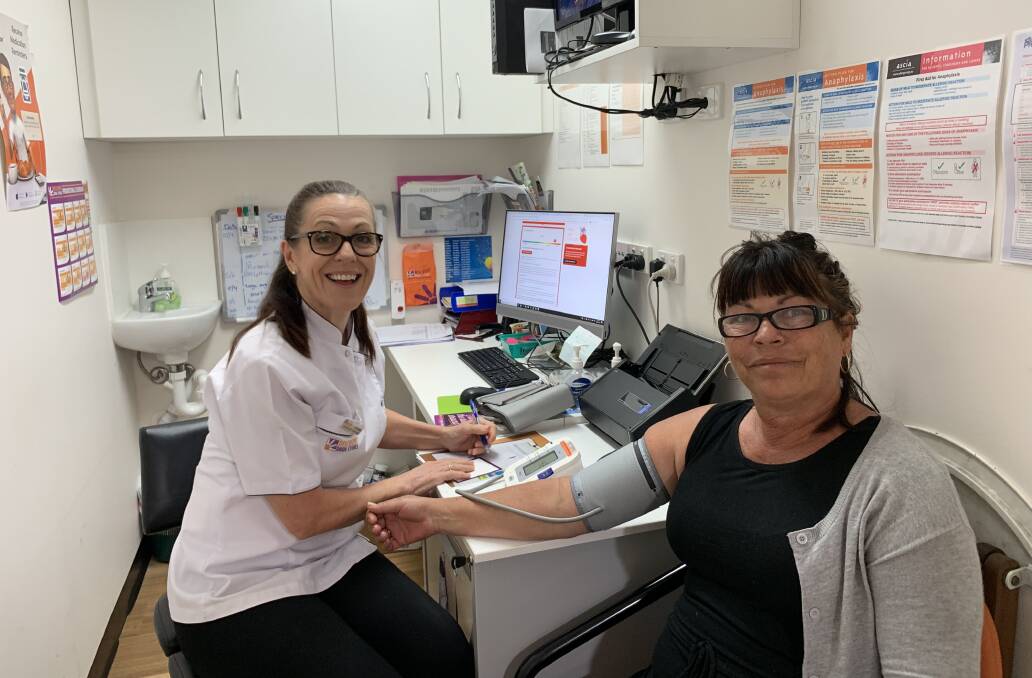 CHECK THIS: Discount Drug Store pharmacist gives Susan Mason from Beaucare a heart health check. Photo: Larraine Sathicq