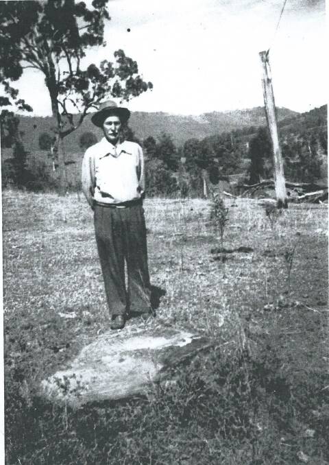 HISTORY: The heritage project is looking for old photos and stories, like this picture of early Tamborine Mountain settle William Curtis, seen here near an Aboriginal grinding stone in 1947, when he was 88-years-old.