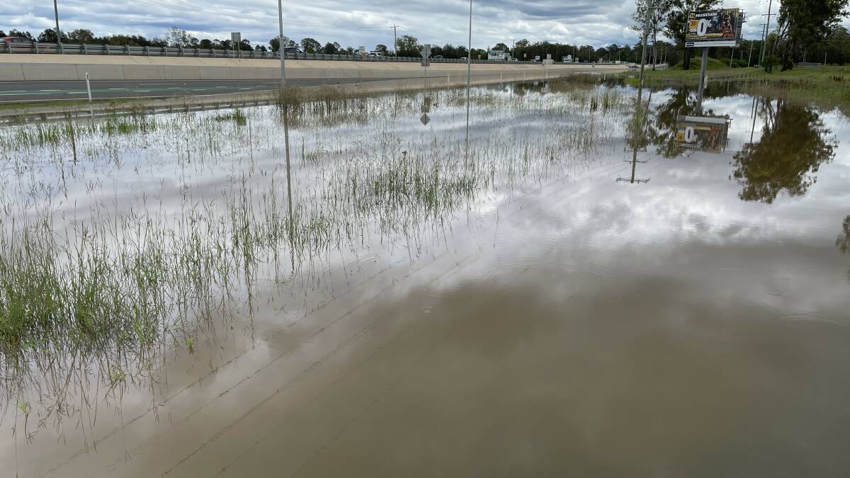 Flooded: The rain has eased but there is still plenty of water around. This was the scene at Jimboomba just after 10am.