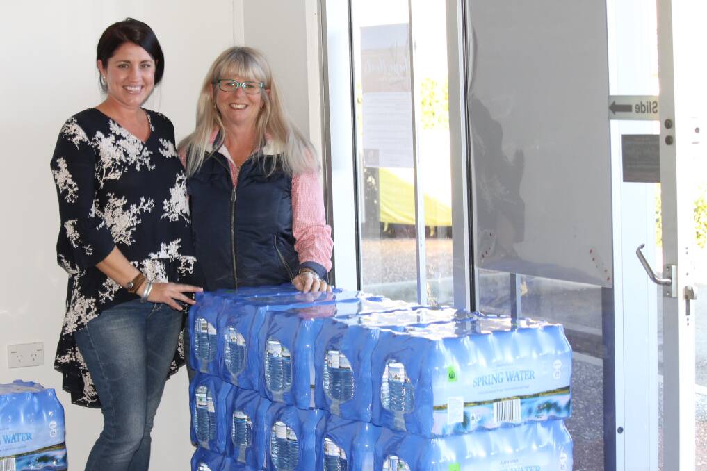 HELP: Holli Annie and Jo Sellens have joined forces to send water to Stanthorpe. Photo: Larraine Sathicq