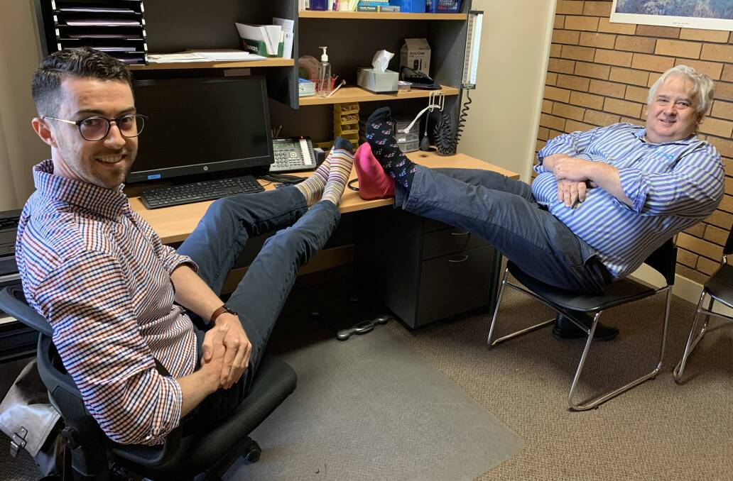 FLASH FOOTWEAR: Dr Alex Oram and Dr Michael Rice showing support for the Crazy Socks 4 Docs campaign. Photo: Larraine Sathicq