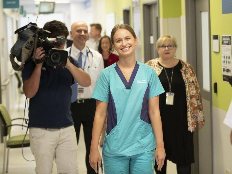 FIRST UP: Gold Coast nurse Zoe Park received Queensland's first dose of the coronavirus vaccine.