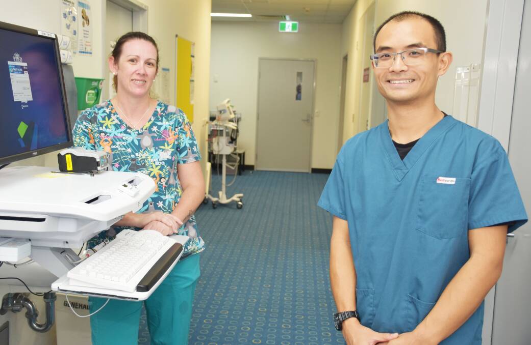 ON CALL: Logan Hospital COVID-19 screening clinic staff RN Nellie Phillips and Dr John Wei.