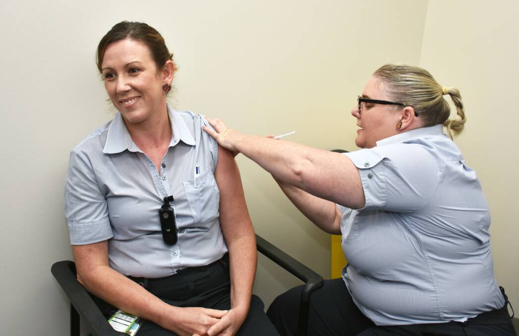 JAB: COVID-19 screening clinic nurse Nellie Phillips was one of the first healthcare workers to get the vaccine at Logan Hospital on Monday.