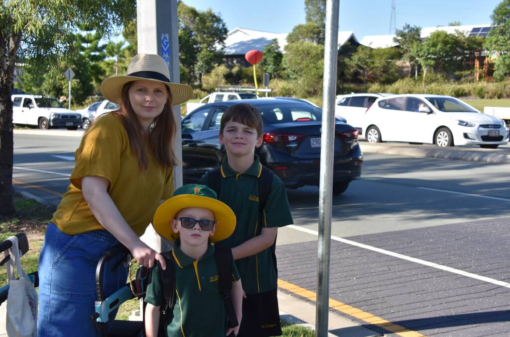 SAFE WALK: Sarah Sheehan with her sons Bentlee, 5 and Mavrick,8 at the intersection at their Yarrabilba school. 