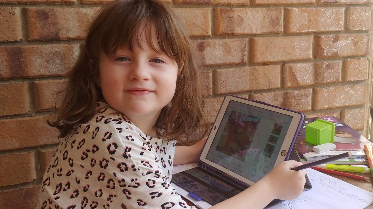 SCHOOL TIME: Logan student Jeannie Hall tackles remote learning with the help of Logan Libraries new home learning hub. 
