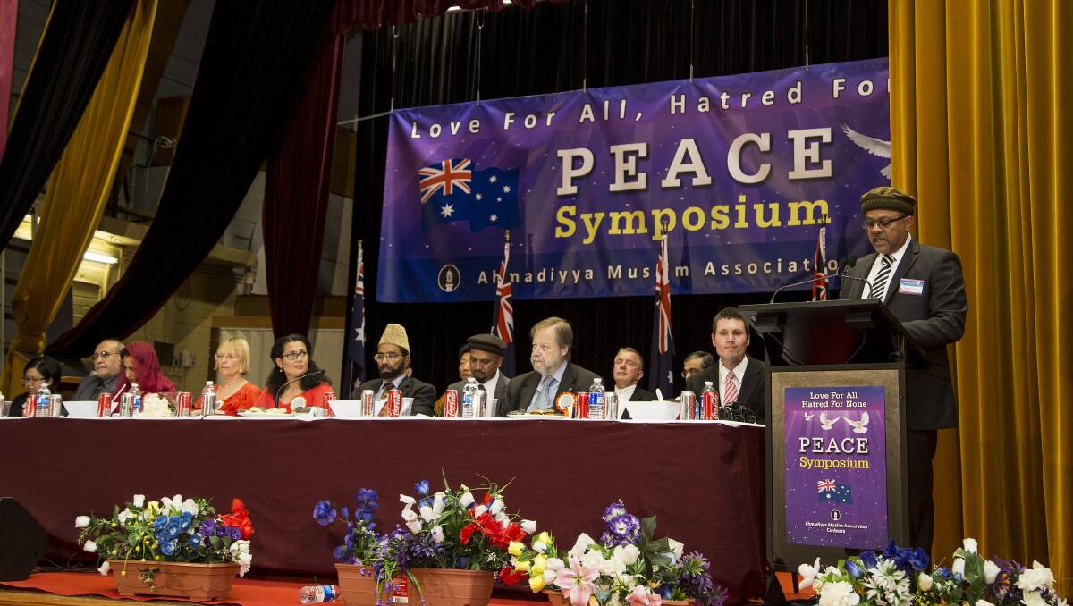 Working towards peace: Delegates at the 2016 Ahmadiyya Muslim peace symposium listen to a speaker. Photo: Supplied