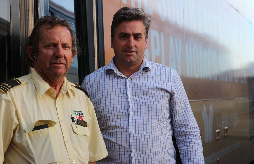 Bus driver Glen, from Logan coaches who will drive the new Yarrabilba service and member for Logan Linus Power MP.