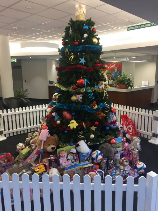 Spirit of giving: The tree at council's offices is already filling up with toys for the less fortunate as part of the mayor's Christmas toy drive.