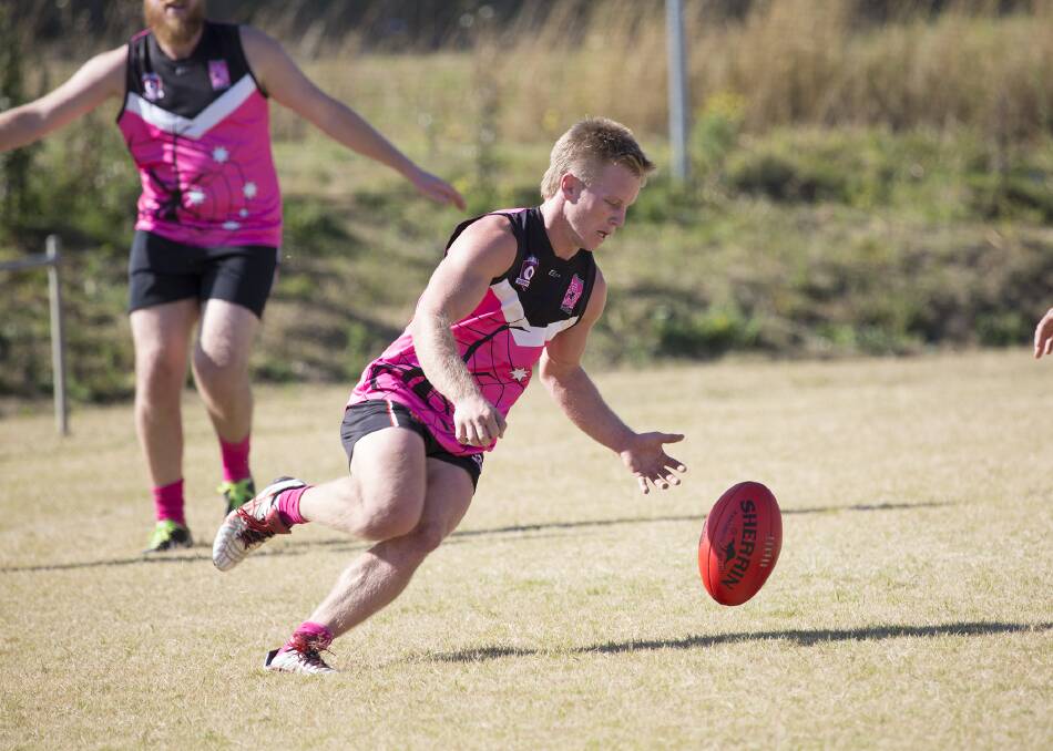 Jacob Guise tracks the ball in the Jimboomba Redbacks charity day game in 2015.