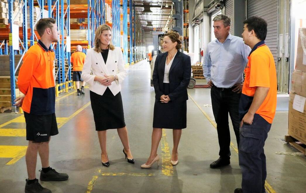 VISIT: Employment Minister Shannon Fentiman, Deputy Premier Jackie Trad and Logan MP Linus Power chat to Back to Work program participants Liam Alder and Dattuan Truong. Photo: Supplied