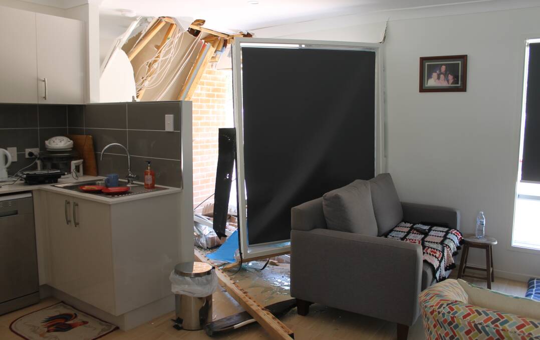 INSIDE: The inside of the flat shows the damage, including the window frame which was pushed behind the lounge where Gloria Lindgren was sitting. Photo: Cheryl Goodenough