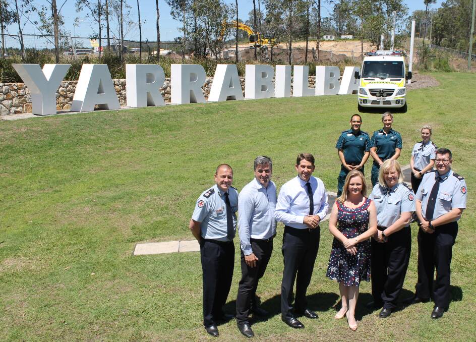 ANNOUNCEMENT: Queensland Ambulance Service Commissioner Russell Bowles, Logan MP Linus Power, Ambulance Services Minister Cameron Dick, Logan councillor Laurie Koranski, QAS Deputy Commissioner Dee Dutton-Taylor and QAS Assistant Commissioner for Metro South Peter Warrener, with paramedics Lisa Carter, Chris Perera and Peta Thompson. Photo: Cheryl Goodenough