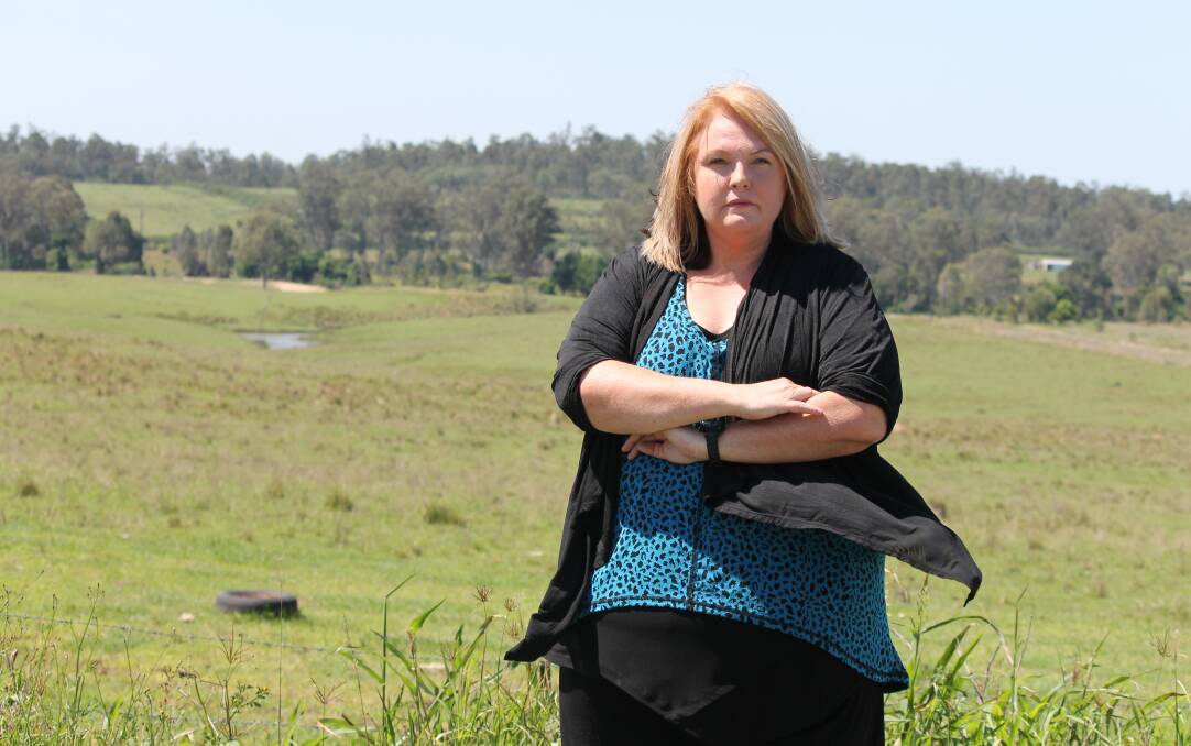 AT THE SITE: Cedar Grove Action Group spokeswoman Debbie Brezac in front of the site where the wastewater treatment plant is proposed to be built. Photo: Cheryl Goodenough