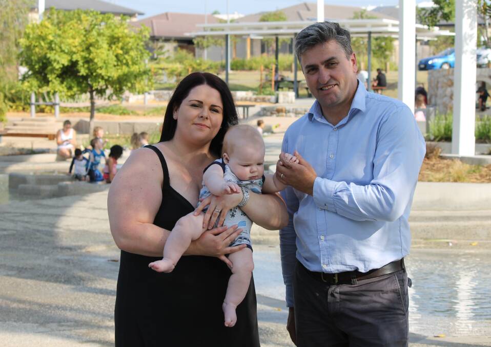 CALL FOR SERVICES: Logan Village resident Theresa Bott, with six-month old Thomas, and Logan MP Linus Power. Ms Bott is calling for an ambulance station at Yarrabilba. Photo: Cheryl Goodenough