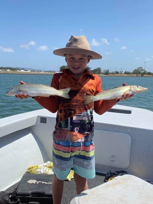 SENSATIONAL CATCH: Keen young angler Jack Watt shows off two 40 centimetre whiting that he caught from Jumpinpin. 