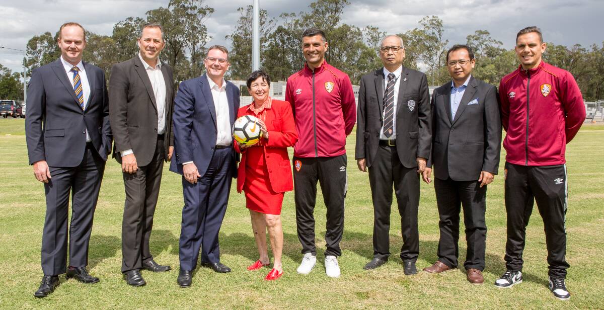 JOINT PROJECT: Logan councillors with representatives from Brisbane Roar. Photo: Supplied