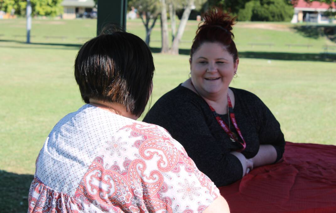 MEETING A NEED: Anglicare Logan case worker Brooke Prickett talks to a foster carer. Photo: Cheryl Goodenough