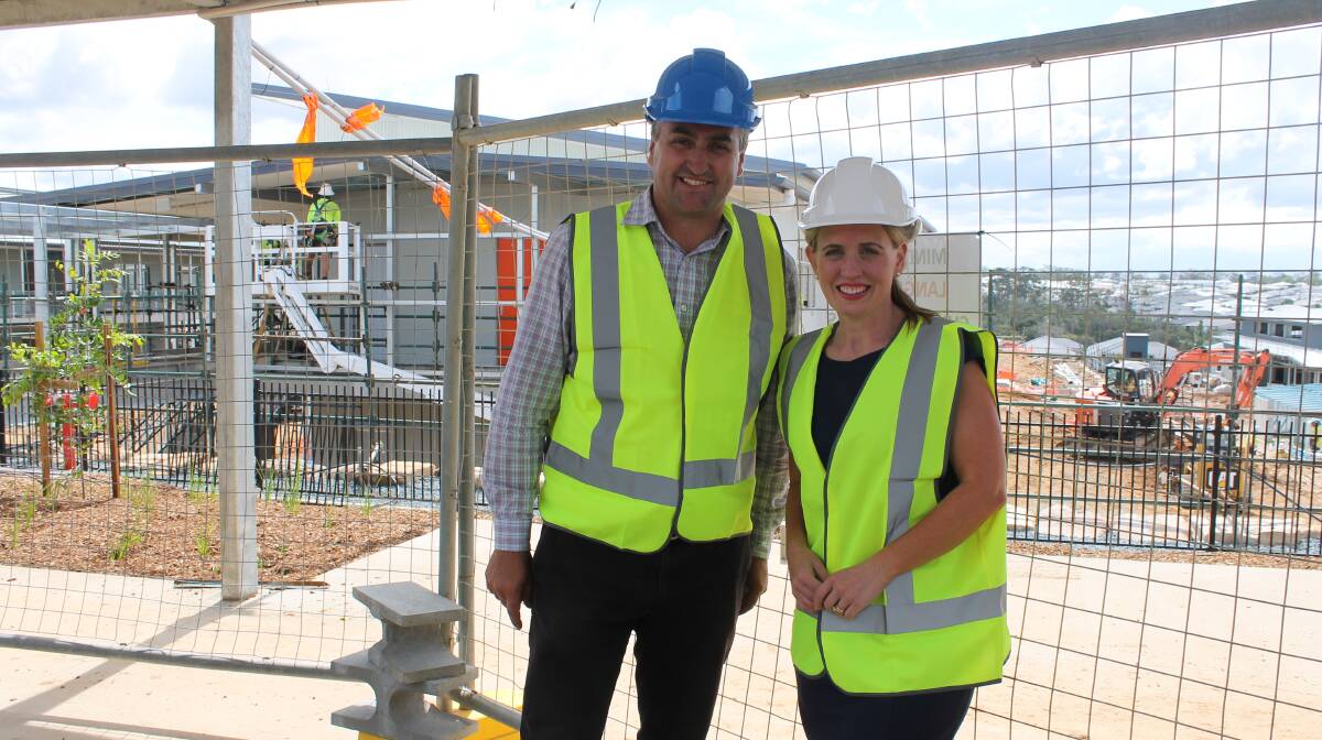 VISIT: Logan MP Linus Power and Education Minister Kate Jones visit the state school under construction at Yarrabilba. The minister announced a high school would open in 2020. Photo: Cheryl Goodenough