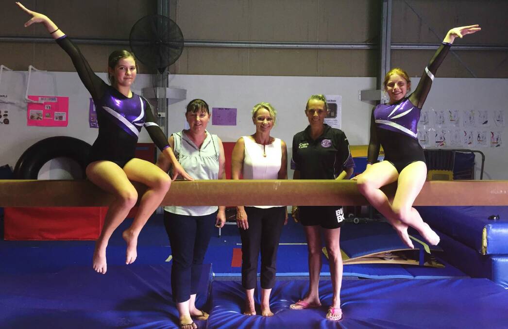 GRANT APPROVED: Logan City Councillor Trevina Schwarz (middle) meets with members of the Jimboomba Gymnastics, including gymnast Mikayla Brennen, club president Christine Lyne, coach Callie Wall and gymnast Brooke Pearson. Photo: Submitted