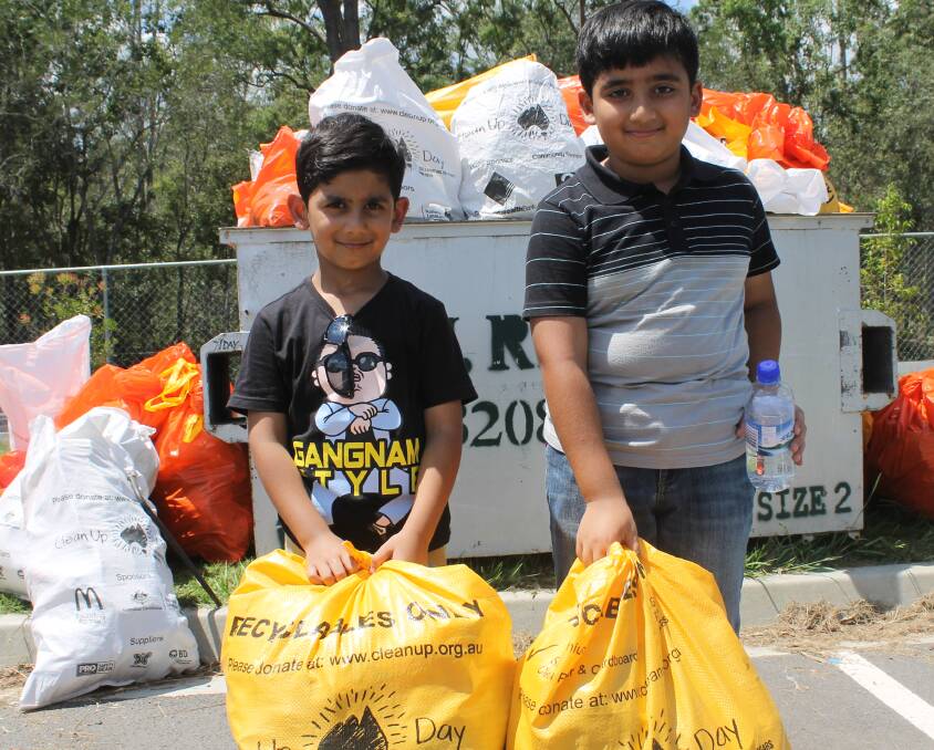 SNAPSHOT: Zeeshan Rahq, 4, and his brother Armaghan, 9, were two of 130 people to help clean up Australia on Clean Up Australia Day in 2015.