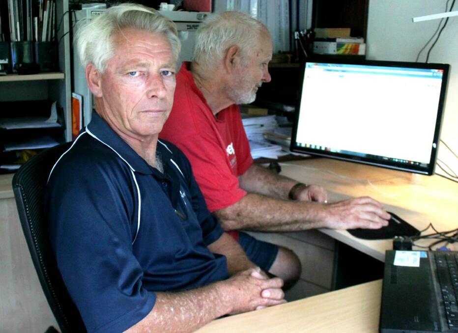 UNANSWERED: Cedar Grove residents Mike Taylor and Stuart Gardam are 'fed up' with not knowing when their connection to the National Broadband Network will start working. Photo: Louise Starkey