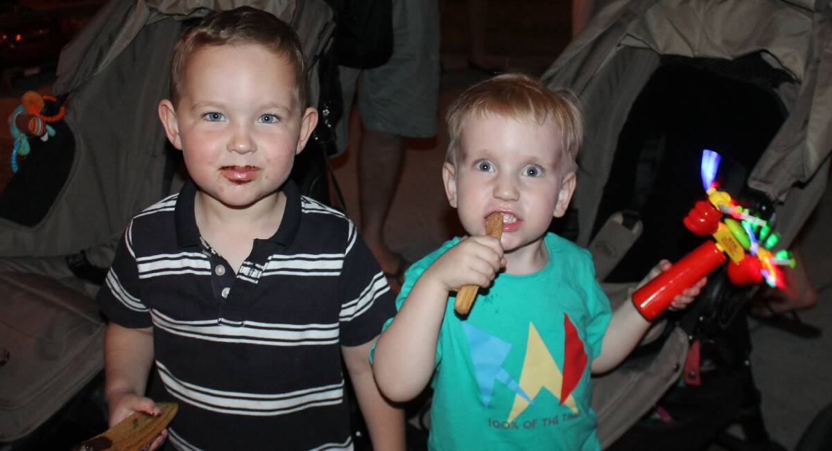 SCRUMPTIOUS: Chase McDonald and Mason Watson, both aged three, enjoyed a churro at Jimboomba's last Eats and Beats in November. Photo: Georgina Bayly
