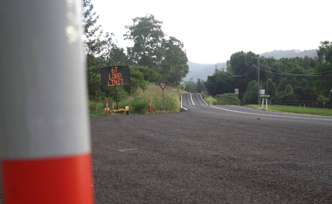 Lamington National Park Road has signs and bollards placed along certain areas. Photo: Jocelyn Garcia