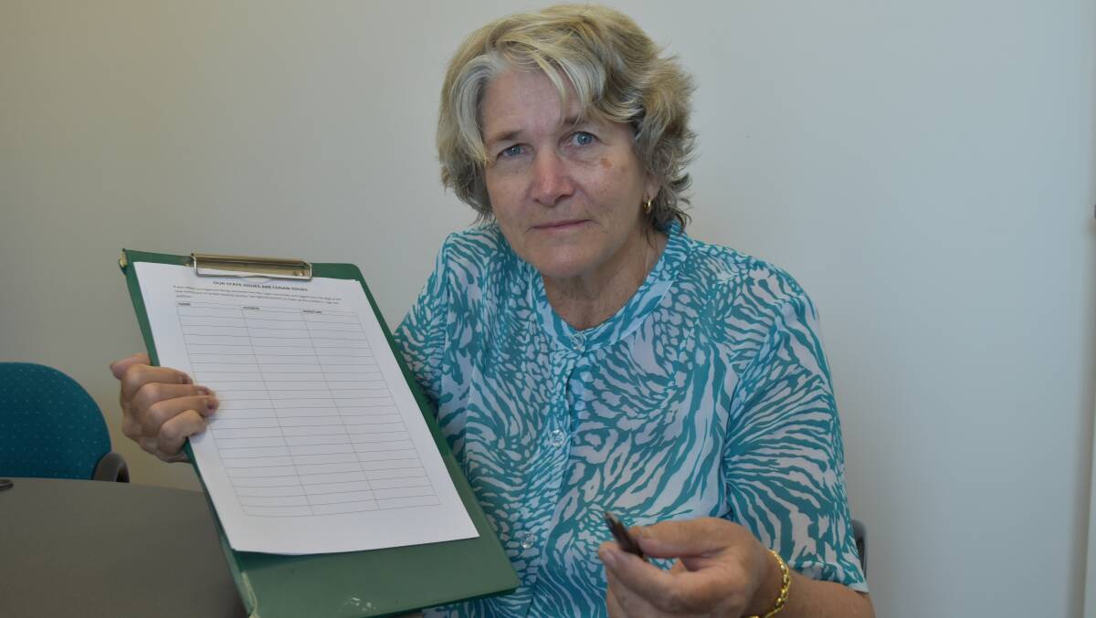 FEEDBACK WANTED: Beverley Mortensen holds the petition objecting to the proposed inclusion of Flagstone into the newly created Jordan district. Photo: Hannah Baker