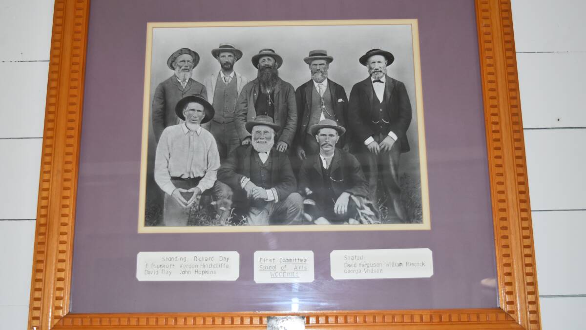 HERITAGE: A photo of the building's original committee which is kept framed in the hall. Arthur Day said some of the serving committee members, including himself, were related to those pictured. Photo: Hannah Baker