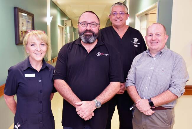 SEPSIS PREVENTION: Damian Jones (second from left) with Redland Hospital emergency department clinical nurse Jessica Hulme, Dr David Van Der Walt and Director of emergency Dr John Sutherland. Photo: Supplied