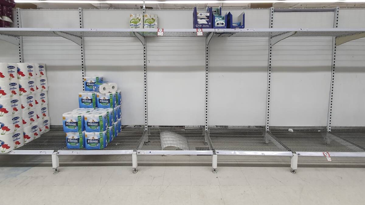 Stocks of toilet paper at a Coles supermarket in Manuka run low as people begin stockpiling groceries. Picture: Sitthixay Ditthavong 