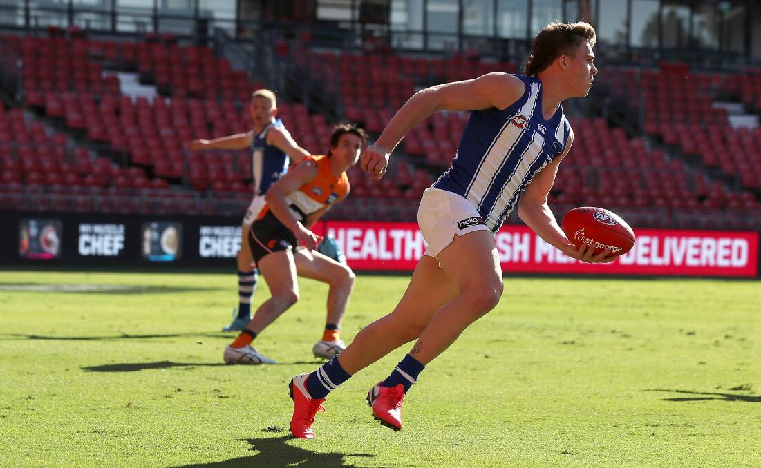 North Melbourne's Cameron Zurhaar about to handball during the match against GWS at Giants Stadium on Sunday. Photo: Mark Kolbe/Getty Images