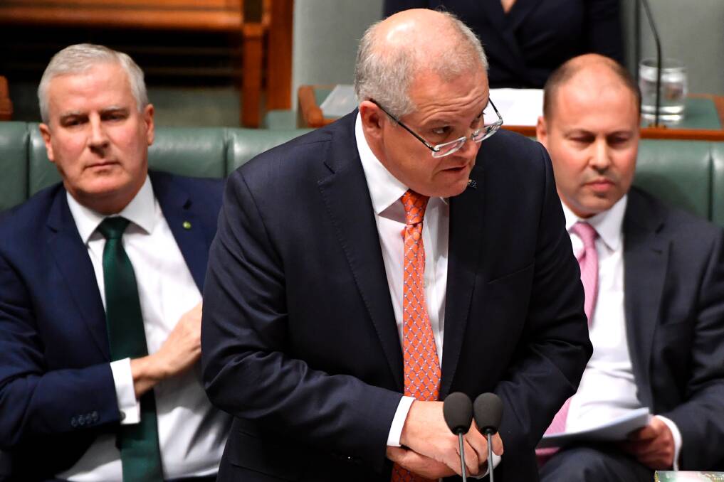 How good is this?: Prime Minister Scott Morrison speaking in Parliament earlier this month. His mantra of a "strong economy" is not the reality for millions of Australians, according to recent reports. Photo: AAP 