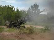 Ukrainian soldiers fire at Russian positions in the eastern Donetsk region.