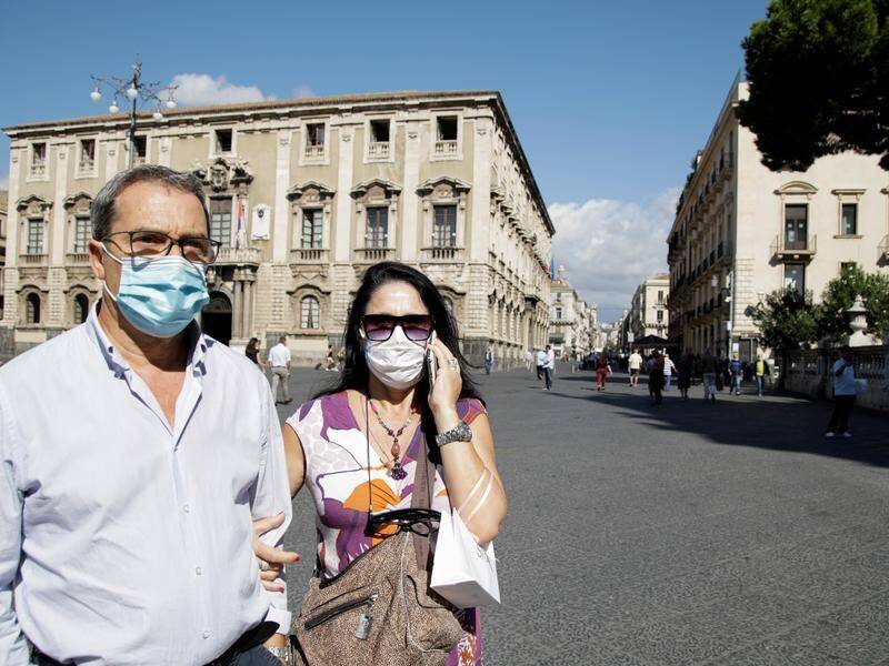 Face masks are being made mandatory outdoors in Rome as virus cases rise.