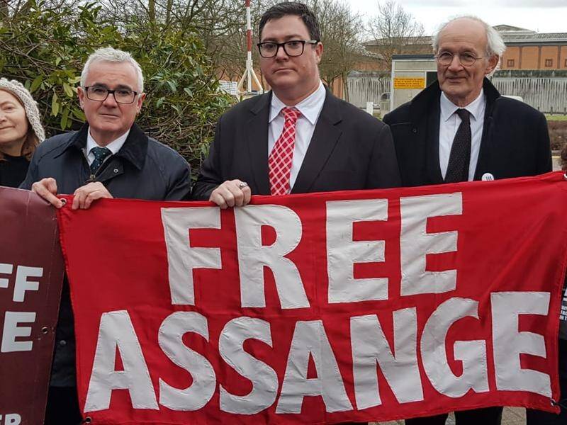 Australian MPs Andrew Wilkie (L) and George Christensen have visited Julian Assange in prison.