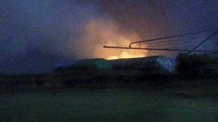 Hay bails burn near Childers on Friday night after a lightning strike. Photo: 93.9