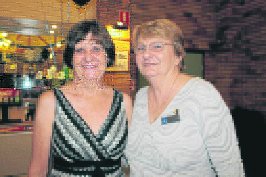 Quota members Dayl Beadle of Mundoolun and Julie Sansom of Stockleigh catch up at the changeover dinner.