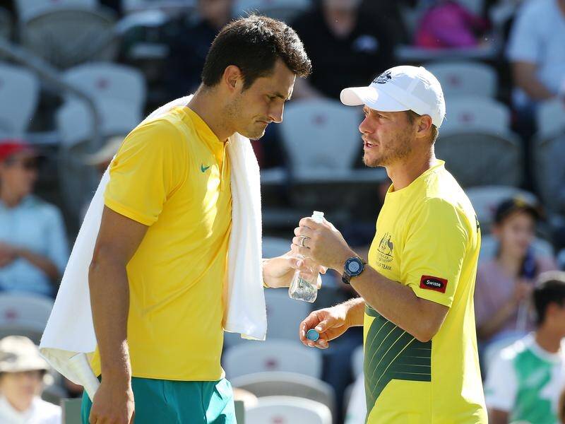 Andre Agassi says only Lleyton Hewitt can win the feud between him and Bernard Tomic.