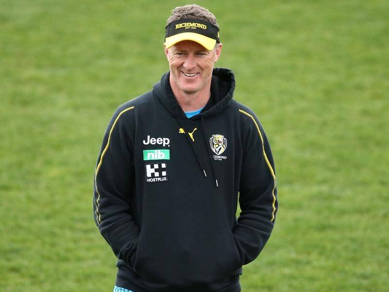 Richmond coach Damien Hardwick has been answering Geelong rival Chris Scott's barbs with a smile.