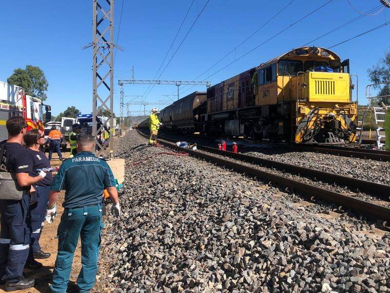 A Queensland Rail driver is dead and two others injured after a train collision near Rockhampton.