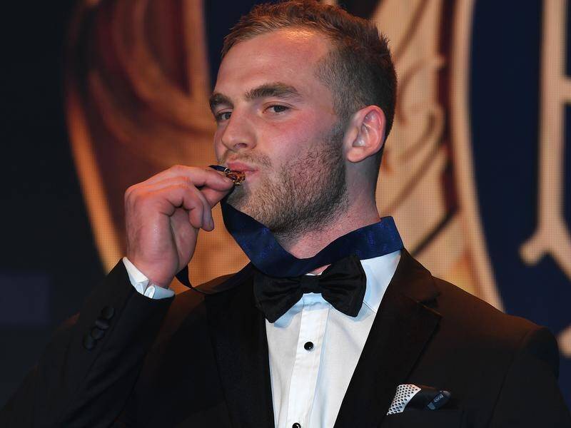 Hawthorn midfielder Tom Mitchell has won the AFL's 2018 Brownlow Medal by four votes.