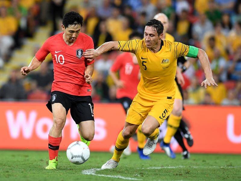 Socceroos captain Mark Milligan (R) is pleased with the way the team performed against South Korea.