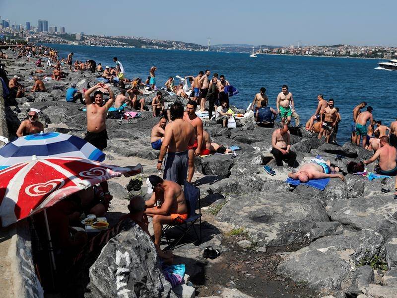 People in Turkey have flocked to shores and parks, prompting a reprimand from the health minister.