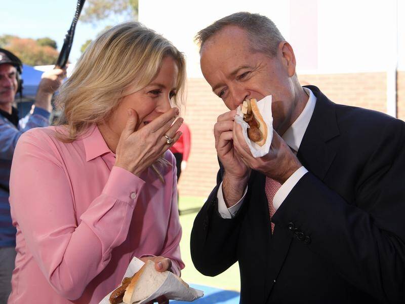 CHOMPING DOWN: Opposition Leader Bill Shorten ate a "democracy sausage" in his Melbourne electorate on Saturday.